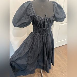 Black Ulla Johnson Palma tie back poplin dress.
